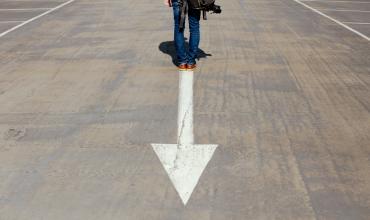 NC Home Advantage Mortgage™ Increases Income Limits to Help More North Carolinians Buy Homes A person standing on an arrow in the road