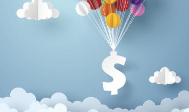 Understanding Mortgage Interest Rates A dollar sign floating with multicolored balloons