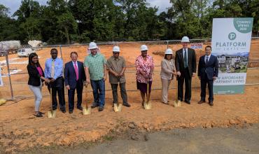 Construction Starts on Affordable Apartments for Charlotte Working Families Photo of people preparing to break ground