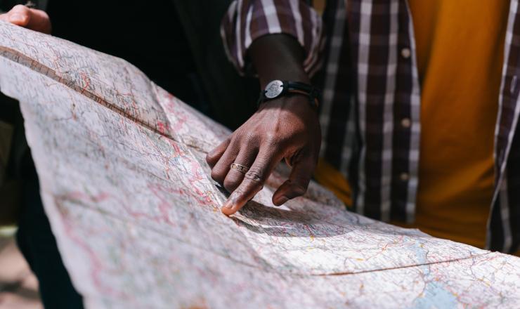 Volunteer pointing at a map