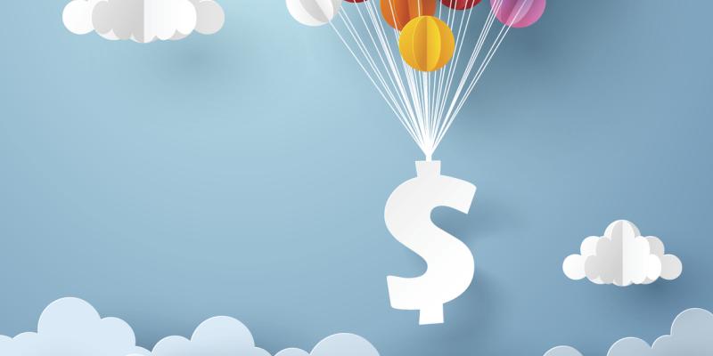 Understanding Mortgage Interest Rates A dollar sign floating with multicolored balloons
